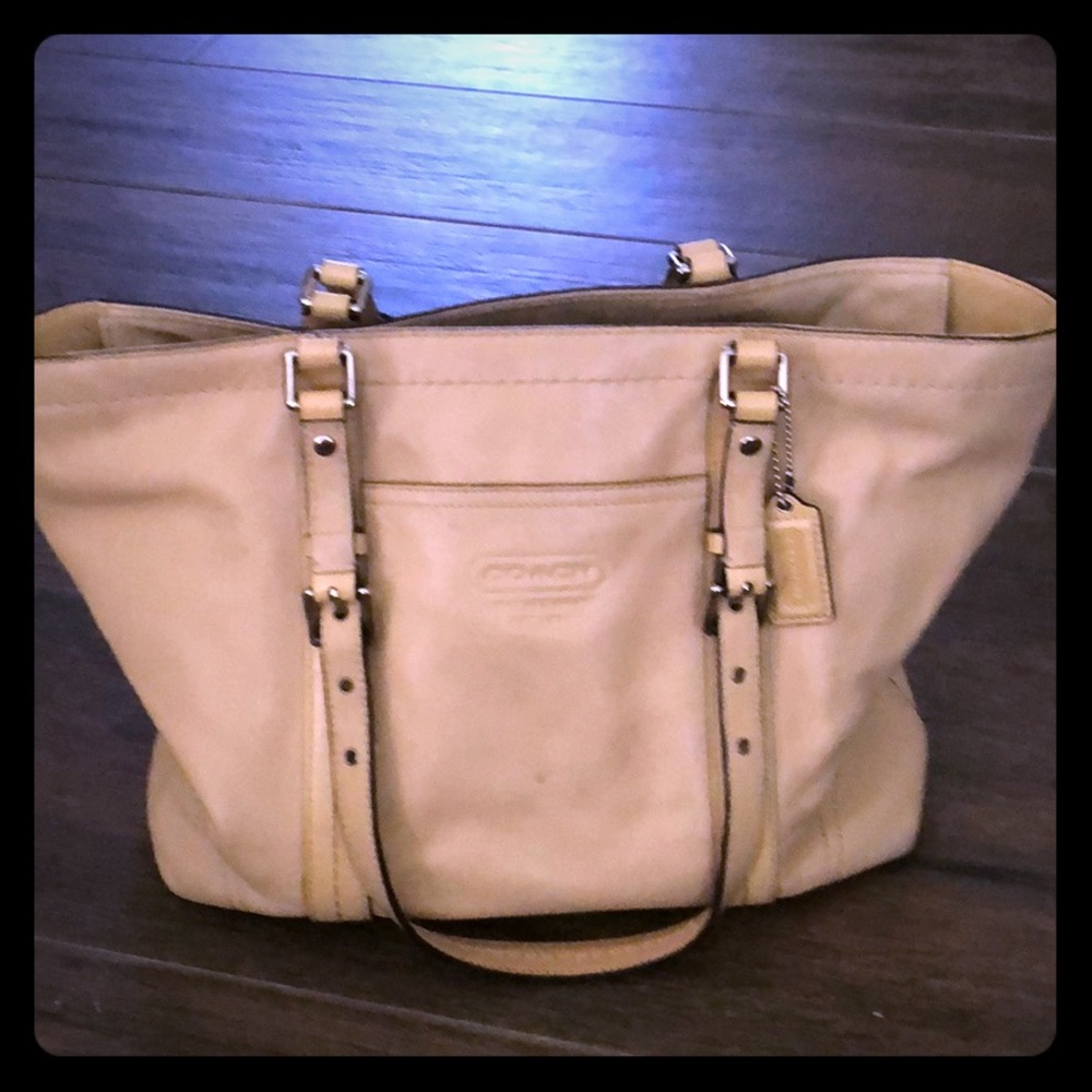 Cream colored Coach purse